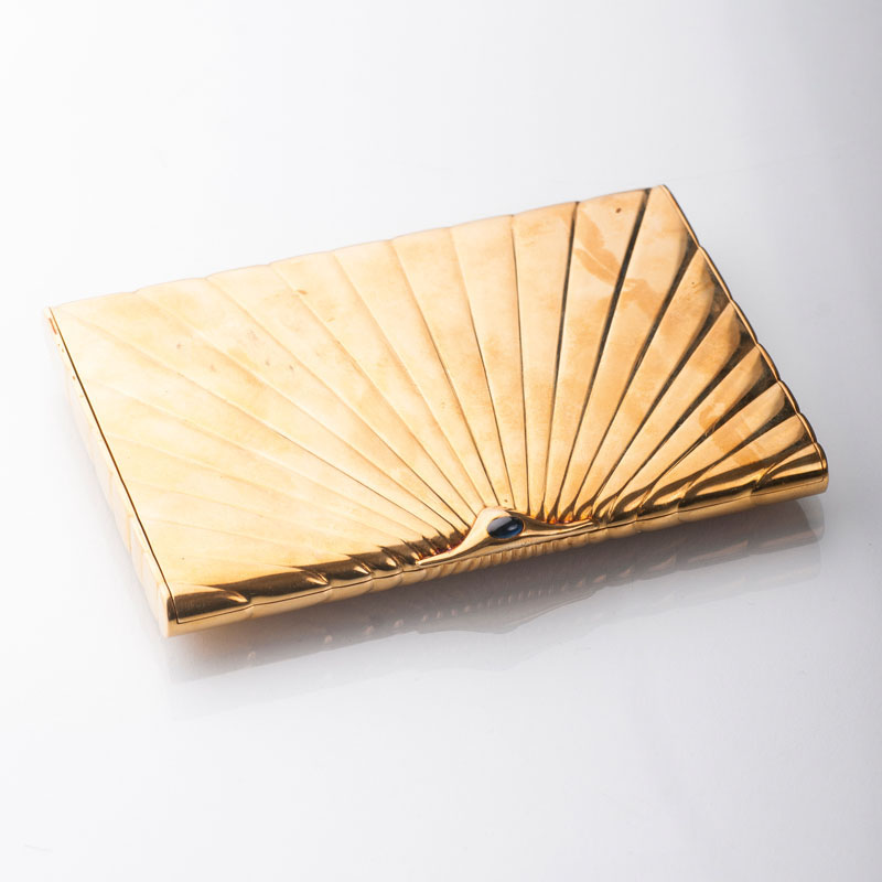 A golden cigarette case