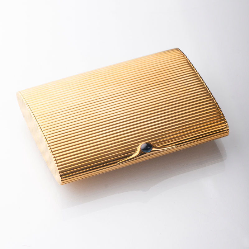 A golden cigarette case