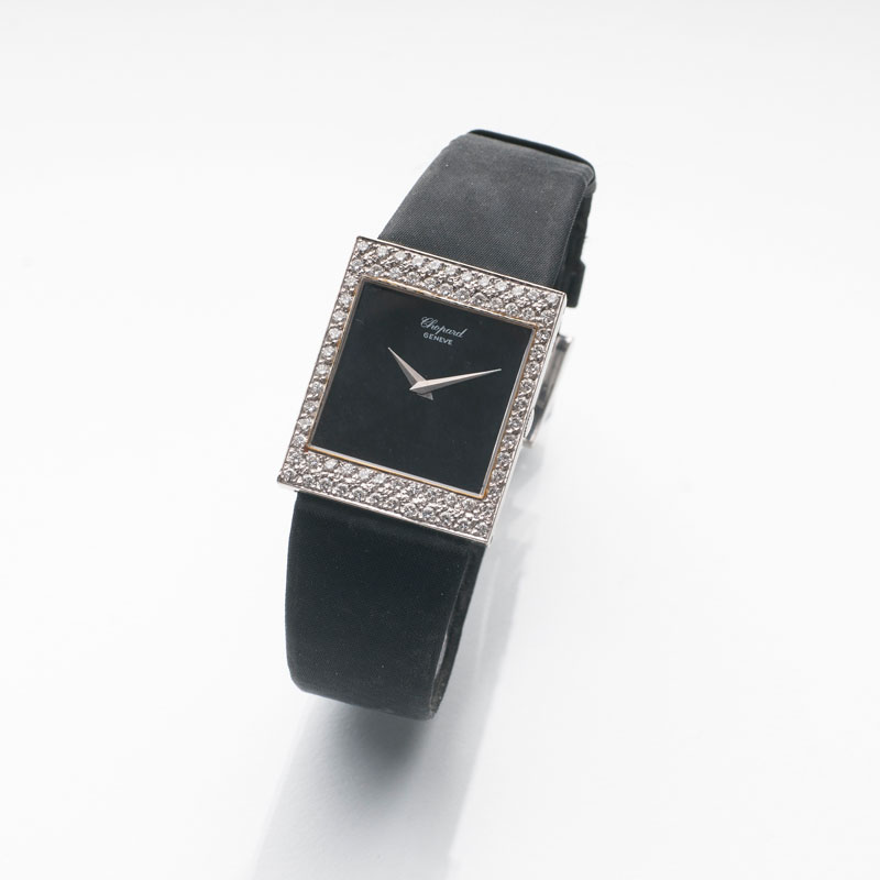 A lady's wrist watch with diamonds by Chopard