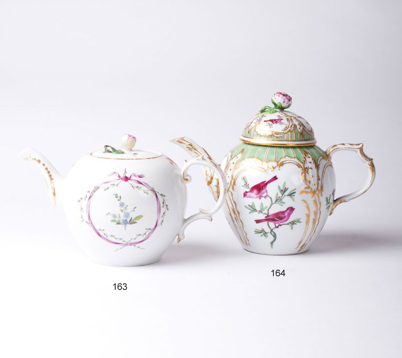 A teapot with bird decoration