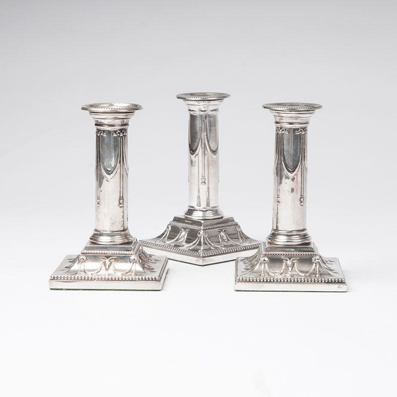 A set of 3 candlesticks of Louis Seize style