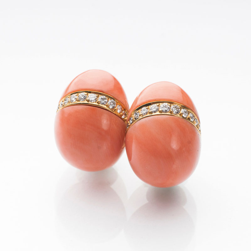A pair of coral earclips with diamonds by Jeweler Schilling