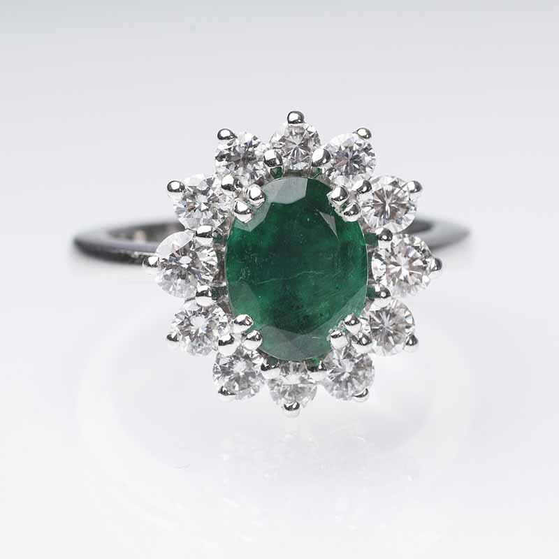 An emerald diamond ring