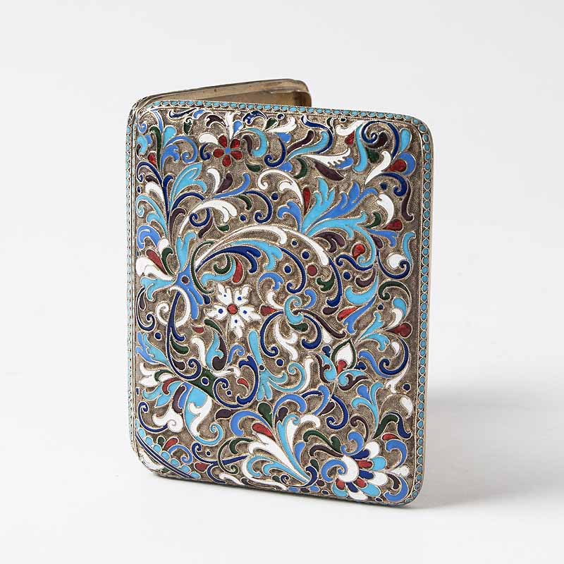 A cigarette case with floral enamel ornaments