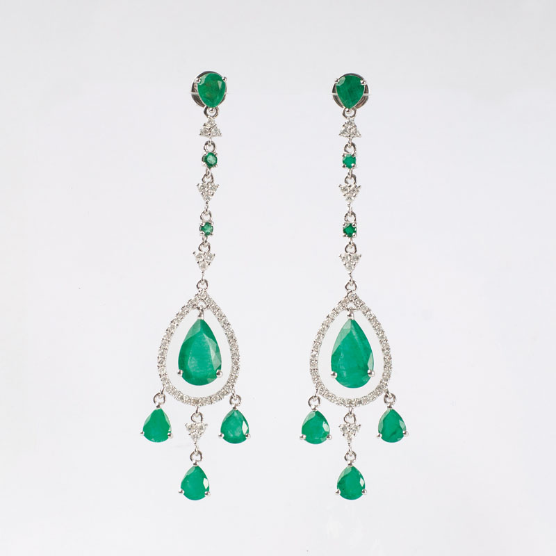 A pair of emerald diamond chandeliers