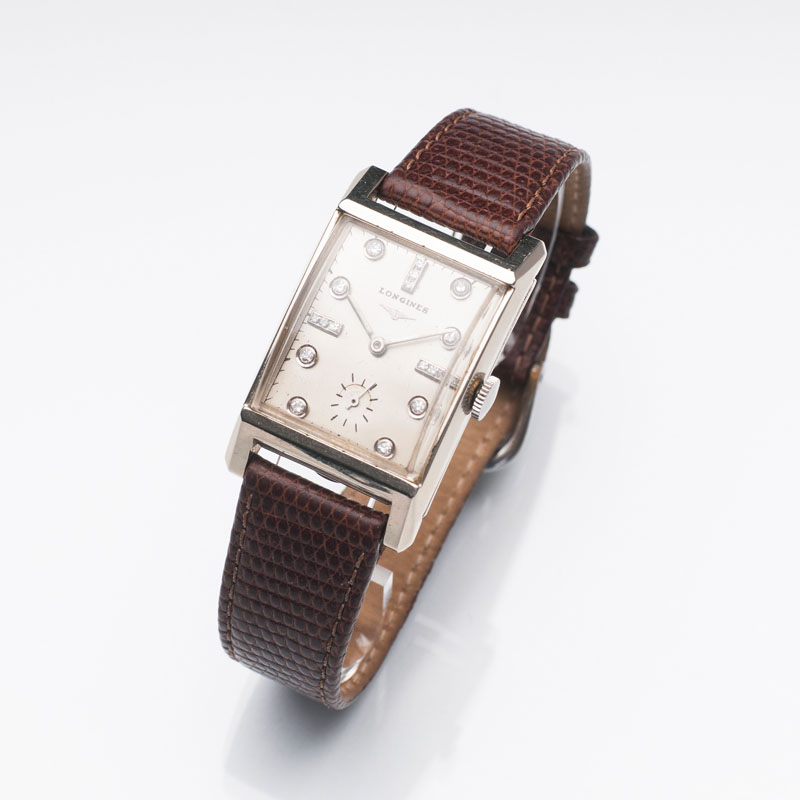 A gentlemen's wrist watch with diamonds by Longines