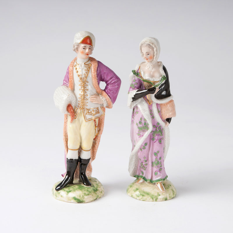 A pair of Ludwigsburg porcelain figures 'a gentleman and a lady with muff'