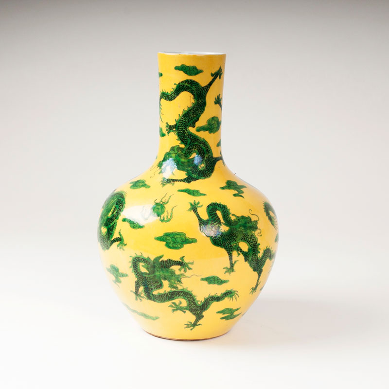 A yellow ground vase with dragon motif