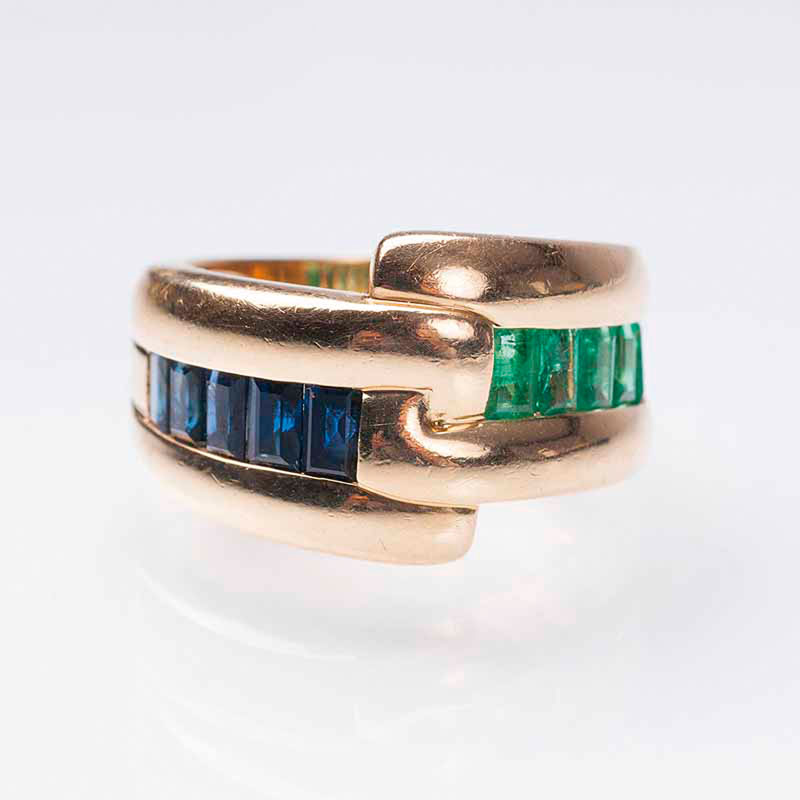 An emerald sapphire ring