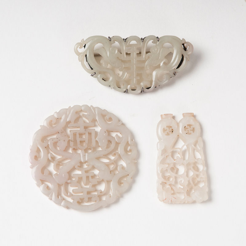 A set of 3 filigree jade carvings