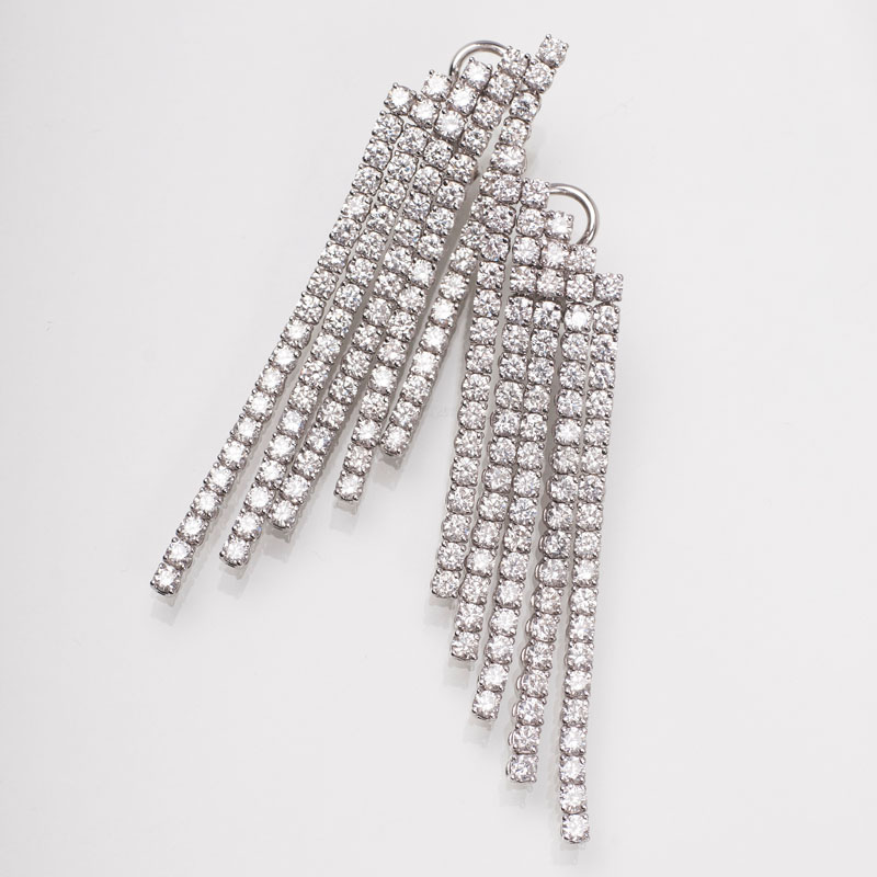A pair of modern, high carat diamond earpendants