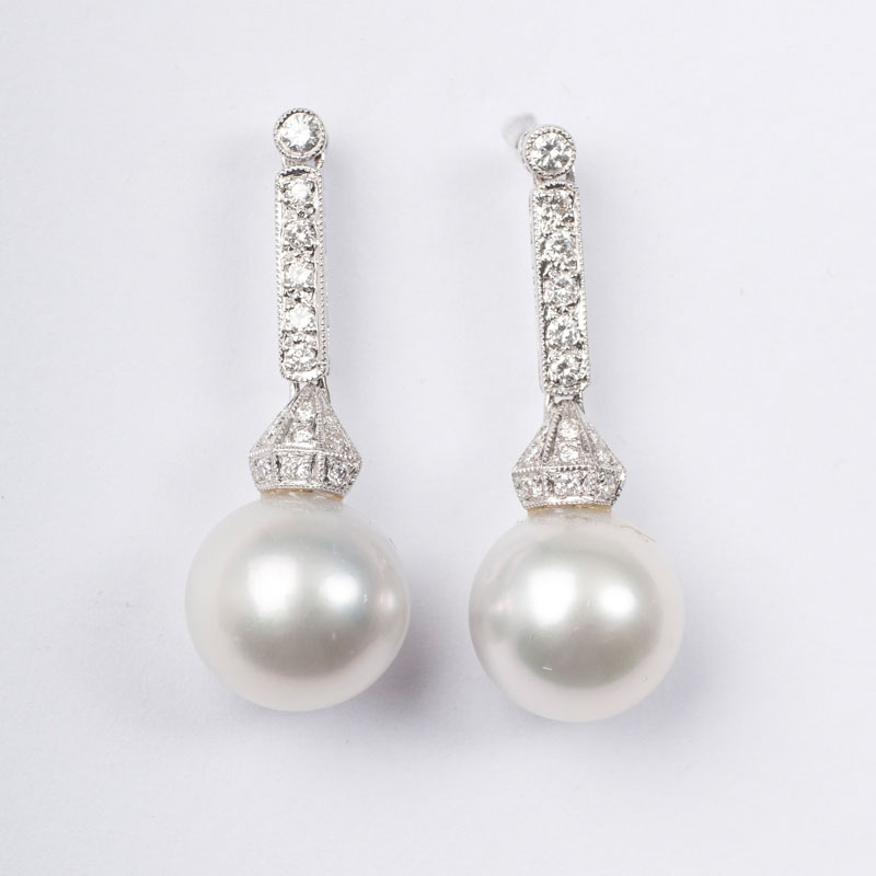 A pair of pearl diamond earpendants