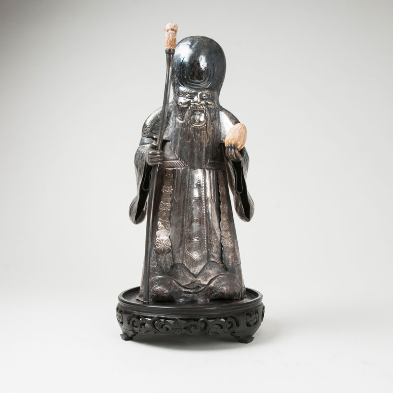 A rare tall silvered sculpture of 'Shoulao' with the peach of longevity A rare tall silvered sculpture of 'Shoulao' with the peach of longevity