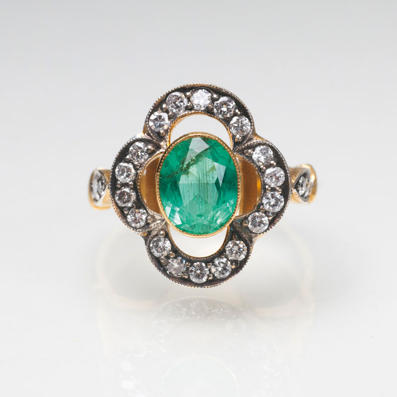 An emerald diamond ring