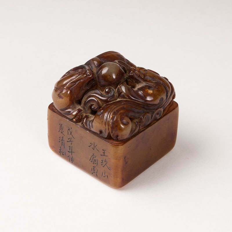 A soapstone seal with a pair of dragons