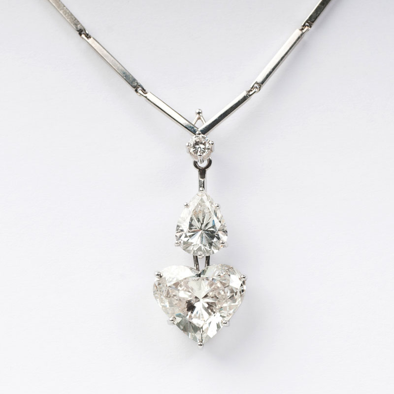 A rare, exquisite and highcarat pendant with fine heart and pear shape diamonds