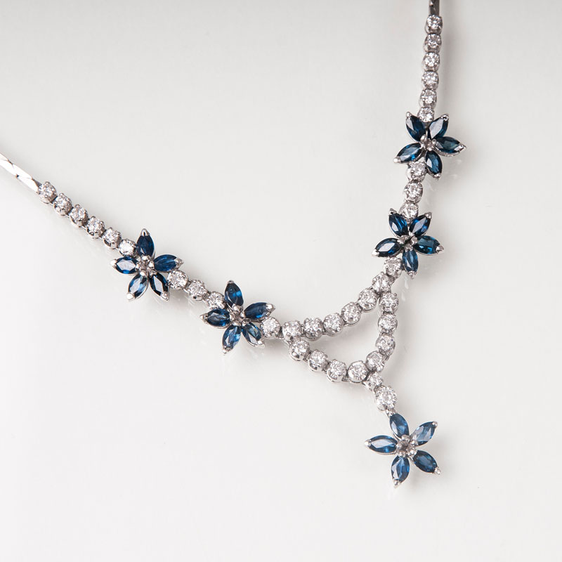 A petite sapphire diamond necklace