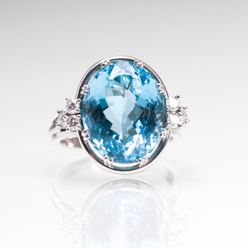 An aquamarine diamond ring