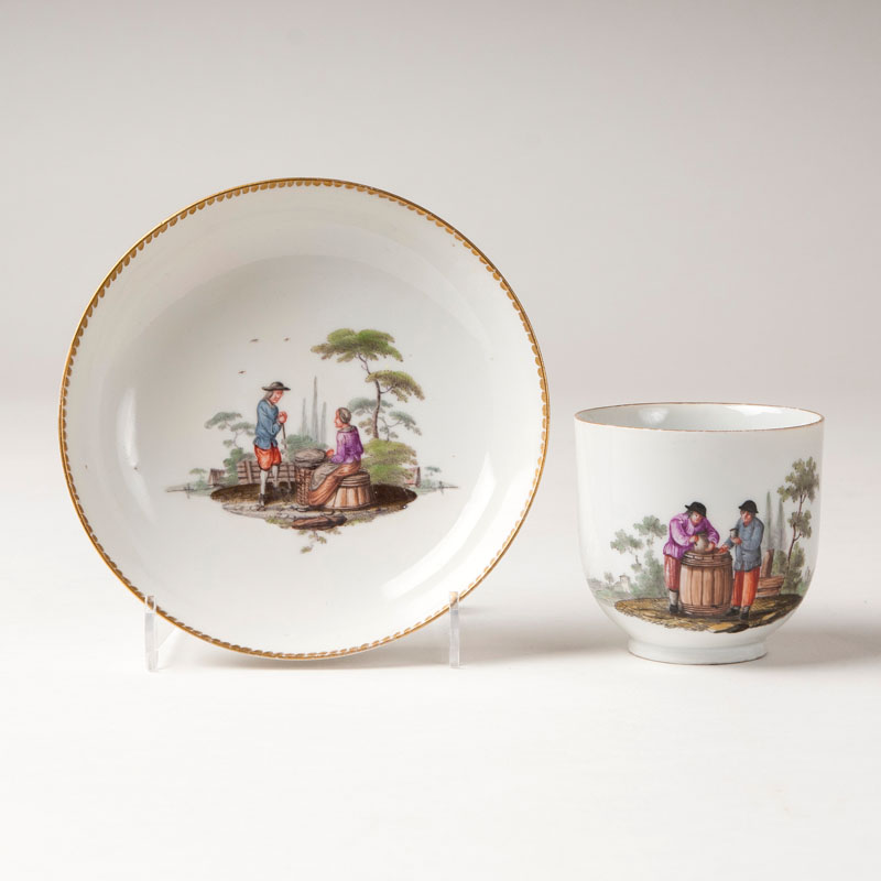 A cup with a dutch peasant scene by Christian Friedrich Kühnel (1719-1792)
