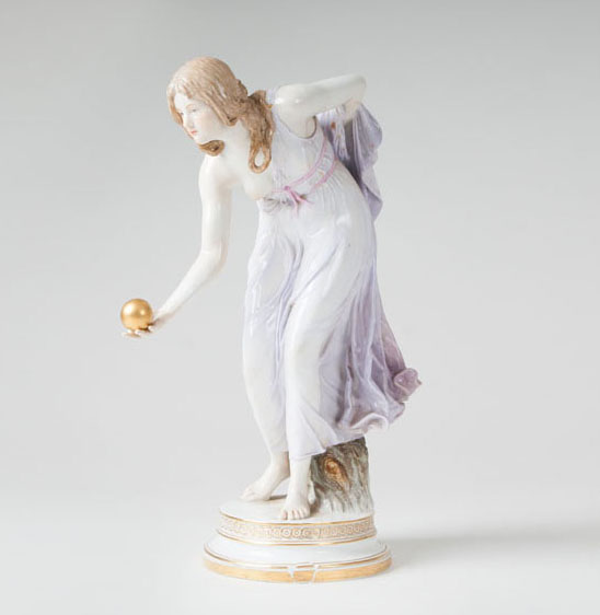 A porcelain figure 'tall female ball player'