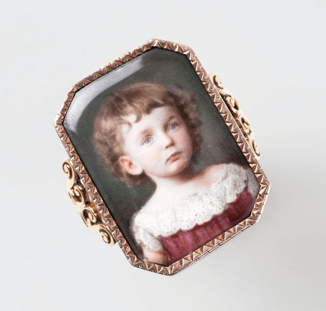 A gold ring with a miniature portrait