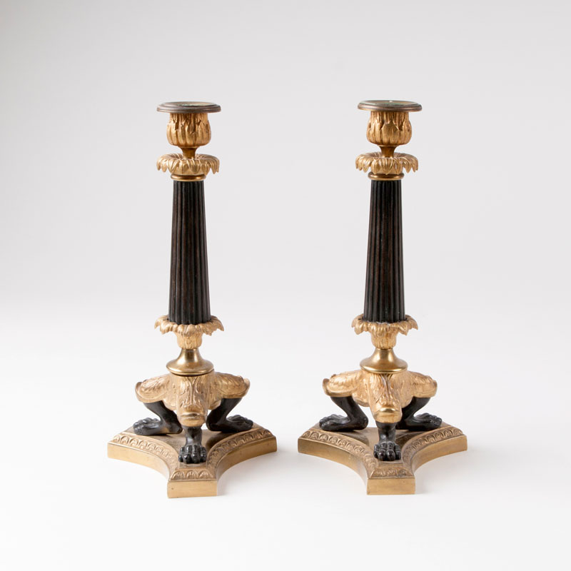 A pair of decorative candlesticks in the style of Charles X
