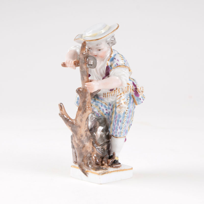 A porcelain figure 'sawing gardener's child'