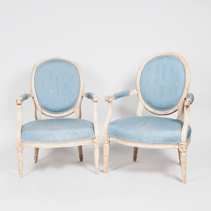 A pair of painted louis-seize-armchairs