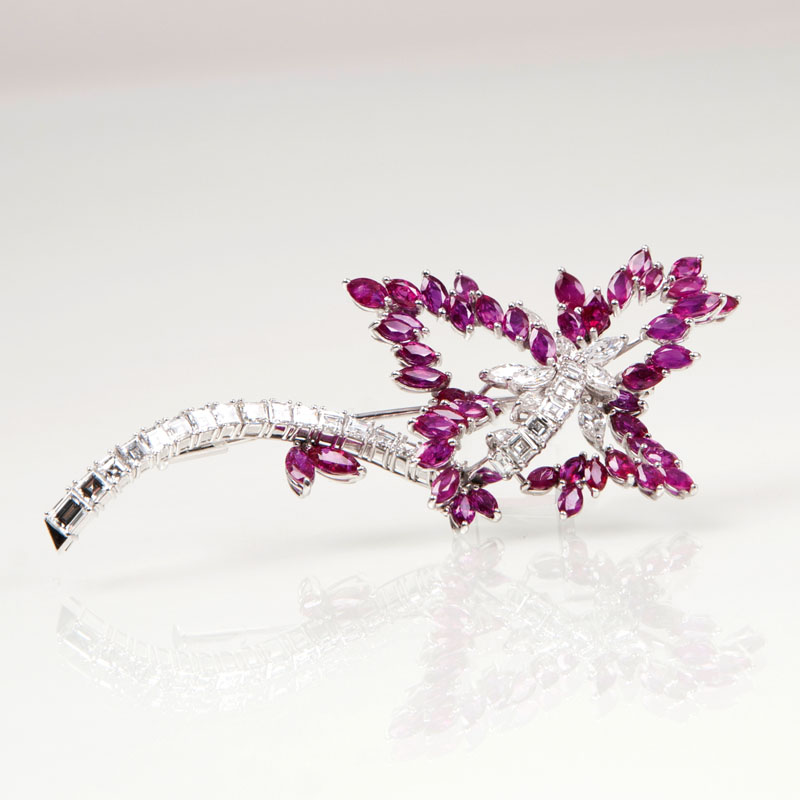 A highcarat flower brooch with diamonds and rubies