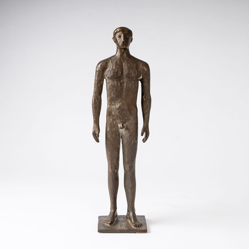A bronze sculpture 'Standing youth'