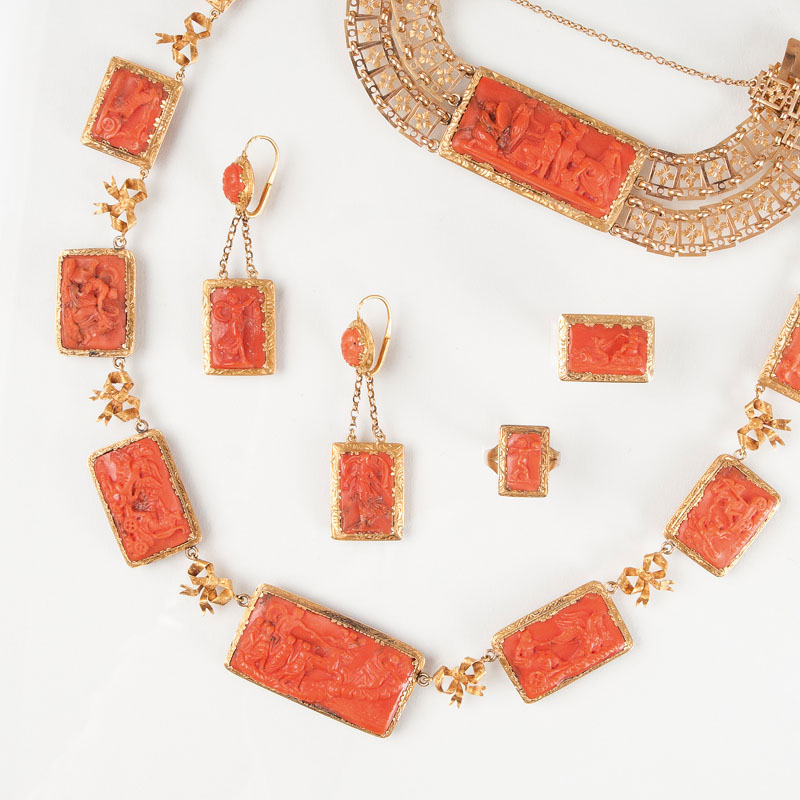 A rare antique coral parure with mythological scenes