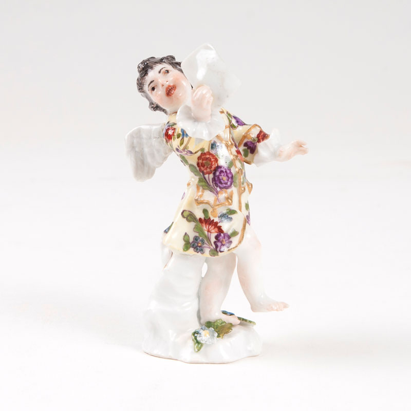 A porcelain figure 'Small disguised amoretto with sheet music'