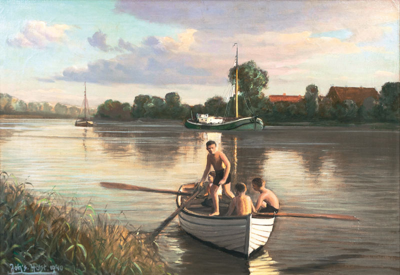 Jungen in einem Boot auf der Süderelbe in Finkenwerder
