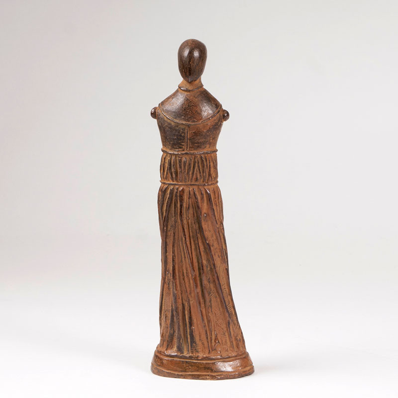 A bronze sculpture 'small draped figure, standing'