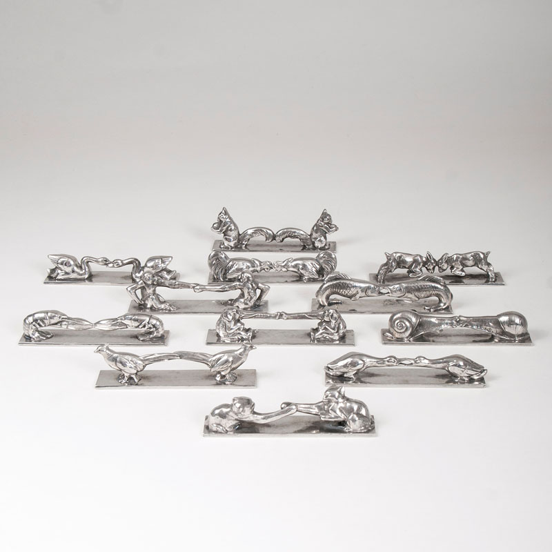 A set of 12 Art Déco knife rests