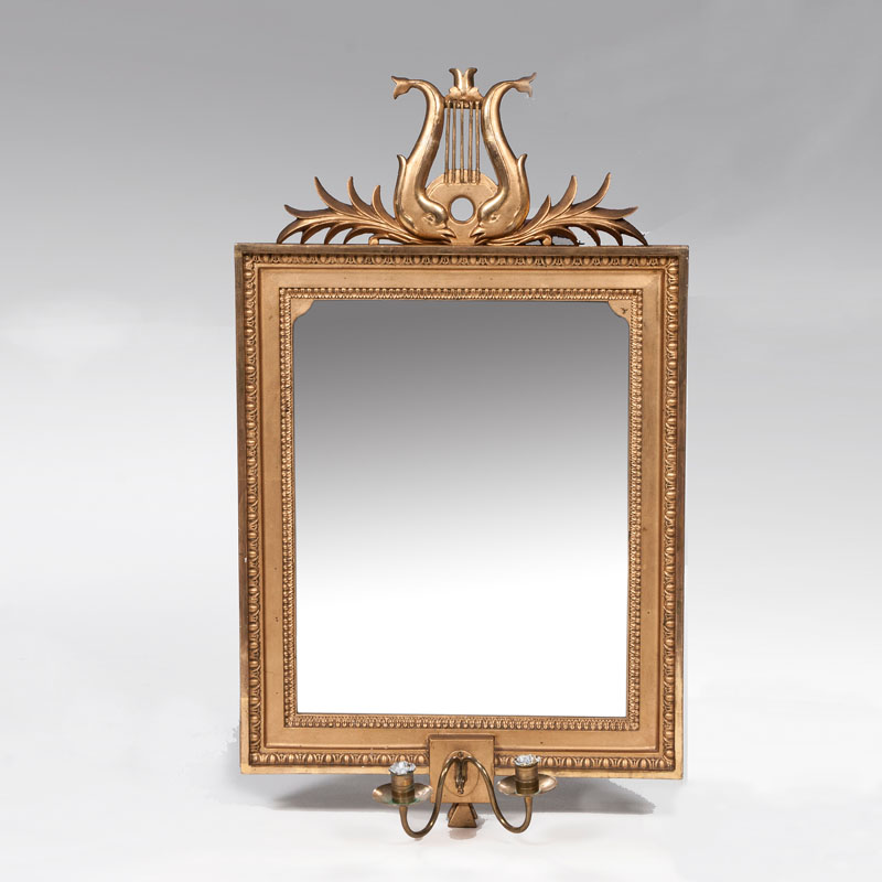 An Empire mirror with lyre decor