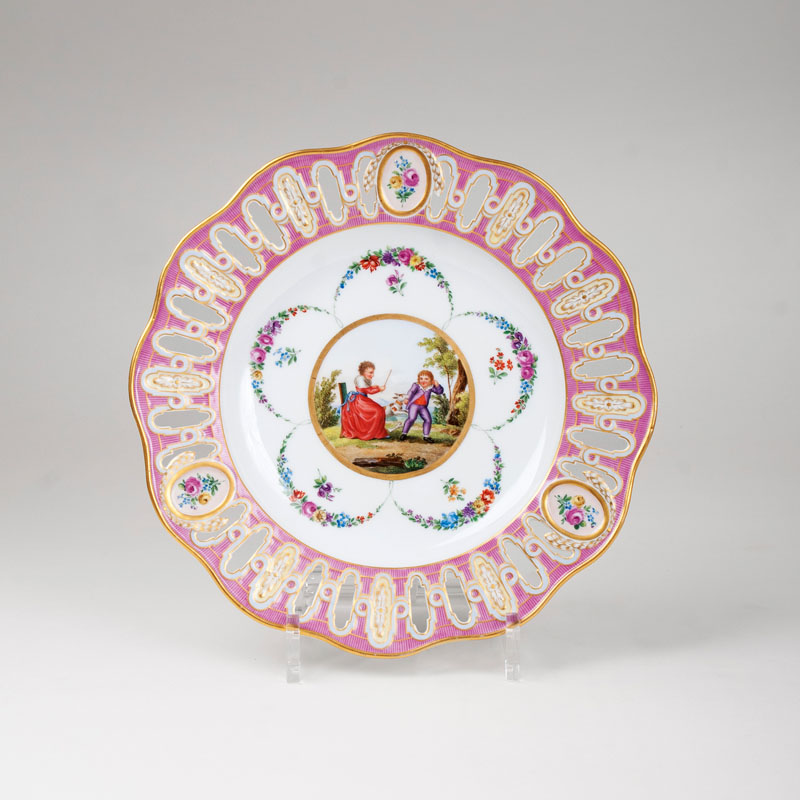 A plate with latticework and a scene of childhood