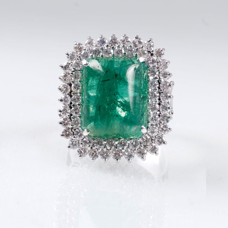A colourful emerald diamond ring