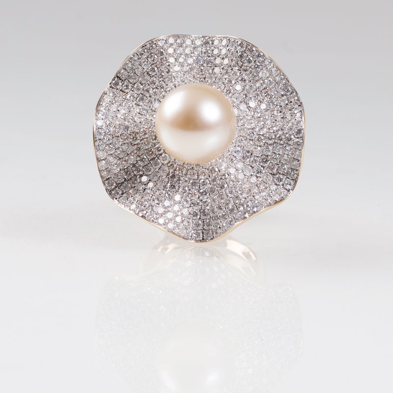 A flowershaped diamond ring with one fine Southsea pearl