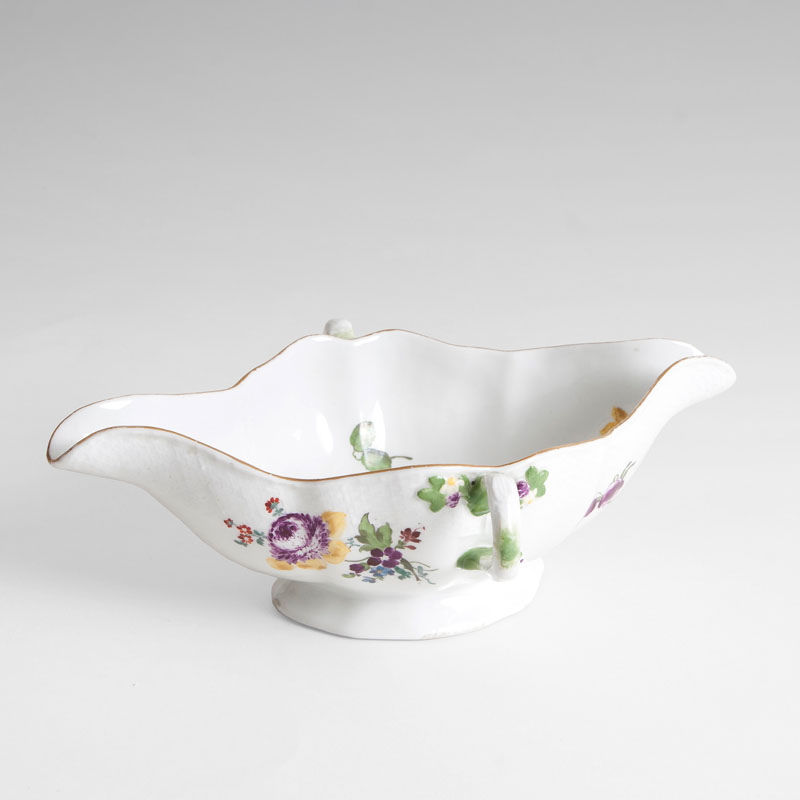 A gravy boat with flower painting