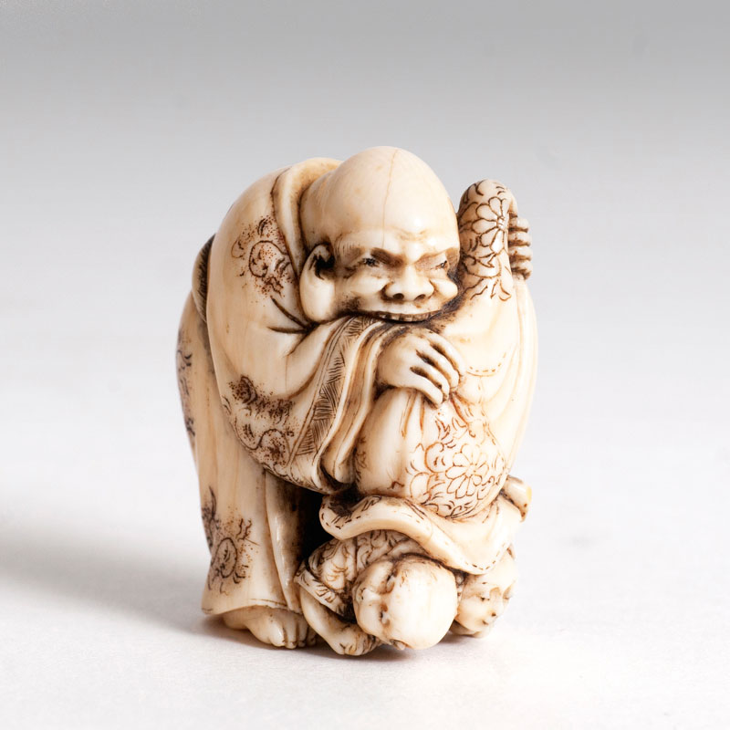 A netsuke 'children out of the bag'