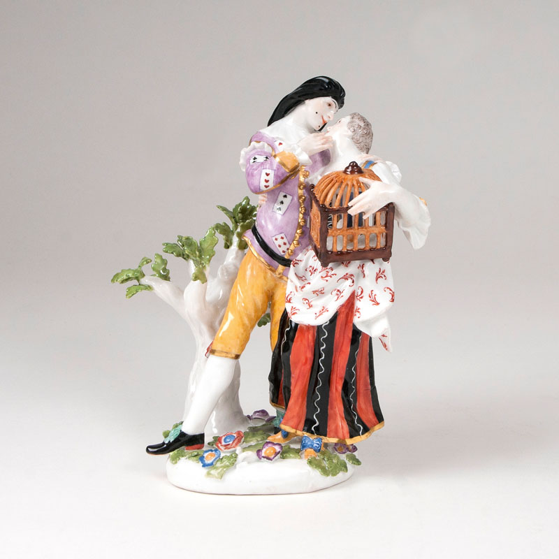 A rare porcelain group 'Mezzetin and young lady with birdcage'