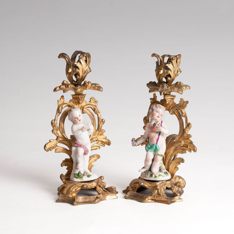 A pair of putti in a gilded bronze mount