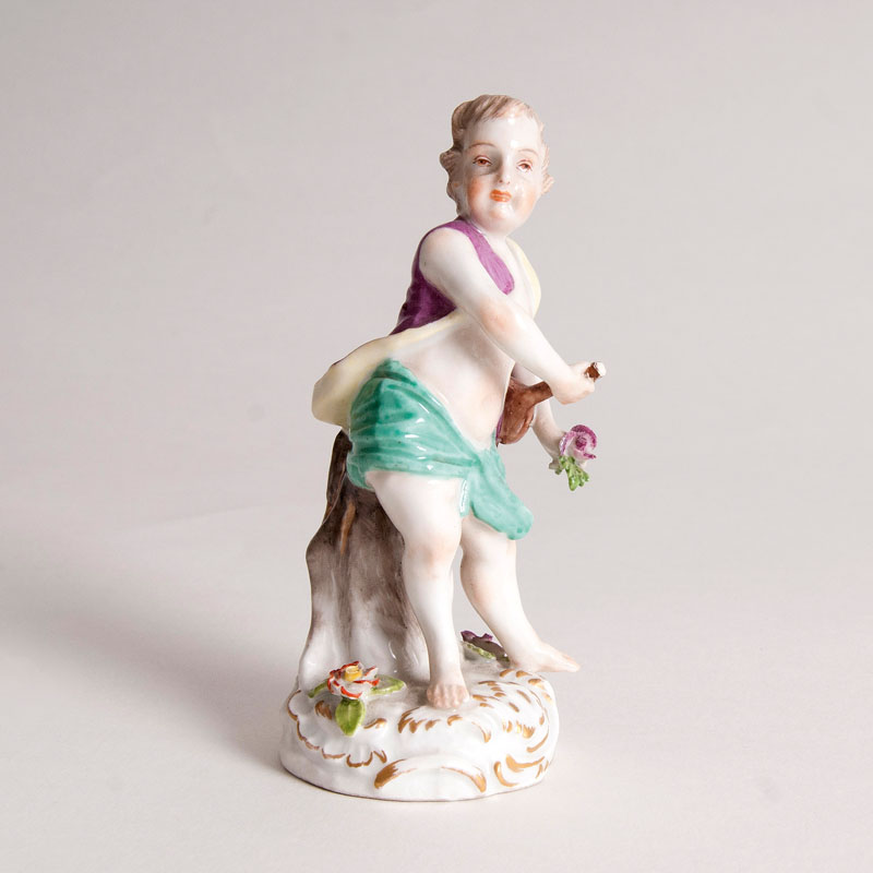 A porcelain figure 'Putto with Violin'