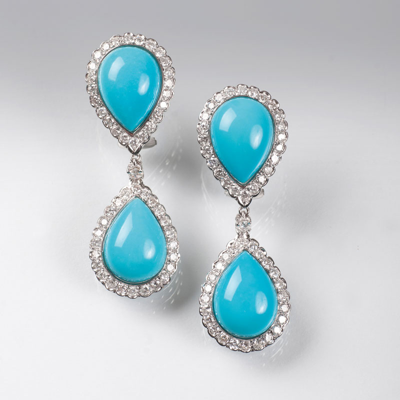 A pair of turquoise diamond earrings
