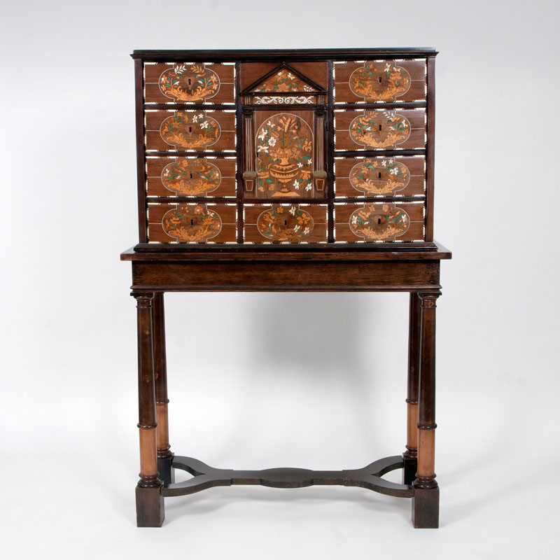 A cabinet with floral marquetry