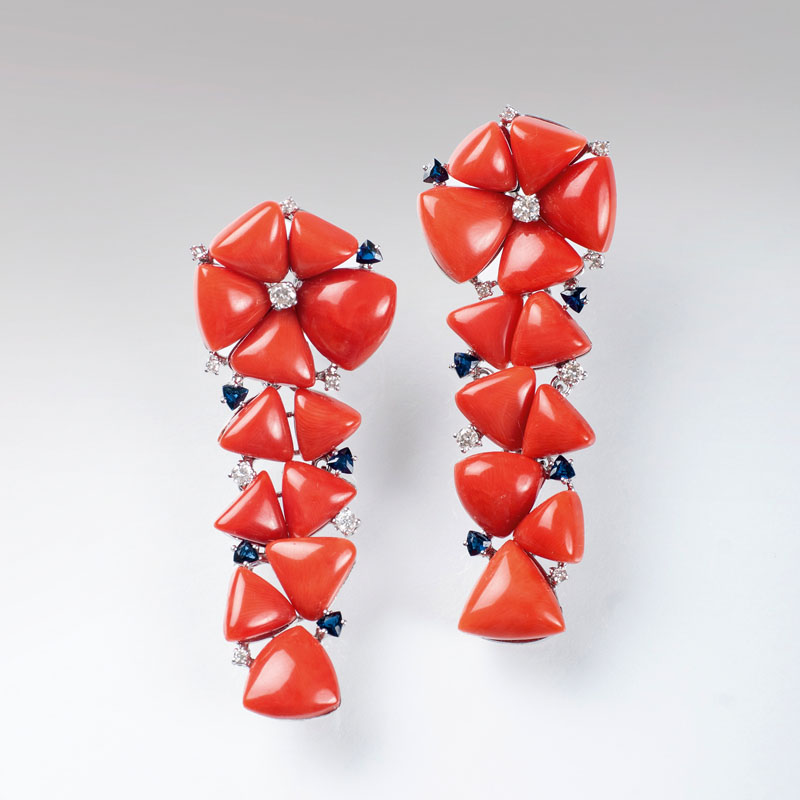 A pair of coral earpendants with diamonds and sapphires