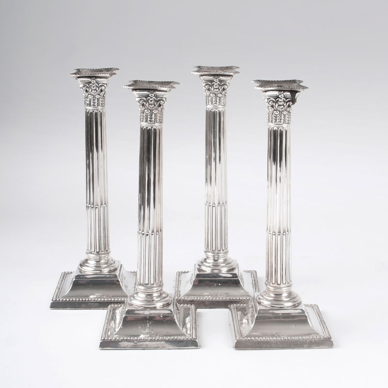 A set of 4 classicistic candlesticks