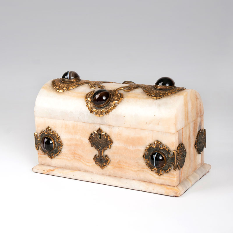 An alabaster casket with agate cabochons