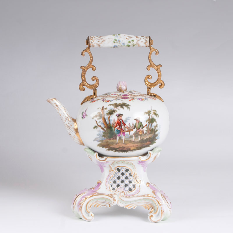 A large tea pot and burner with delicate hunting scenes